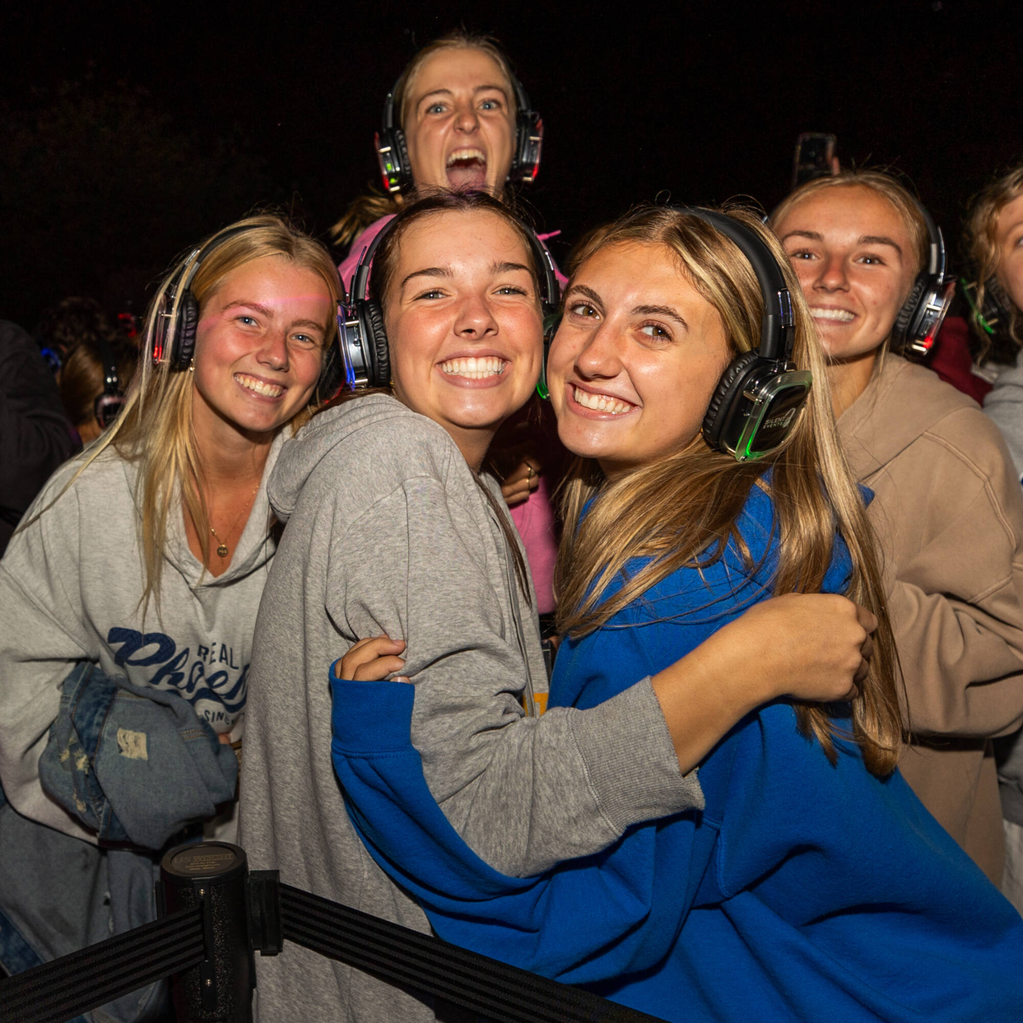 Students hugging at Silent Disco